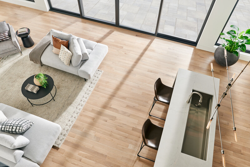 Overhead view of a living room with glass patio doors and furnishings featuring Dundee oak hardwood flooring