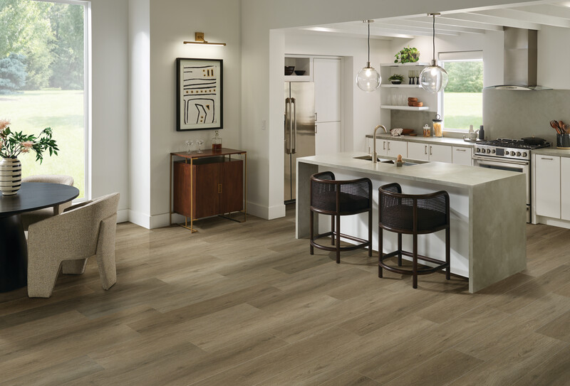 Kitchen using hybrid resilient flooring with an island and chairs